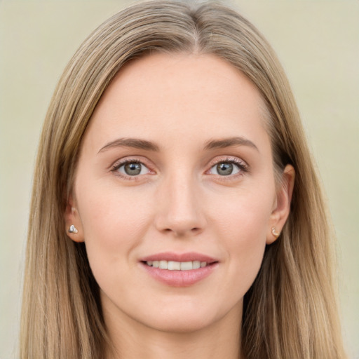 Joyful white young-adult female with long  brown hair and grey eyes