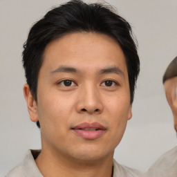 Neutral asian young-adult male with short  brown hair and brown eyes