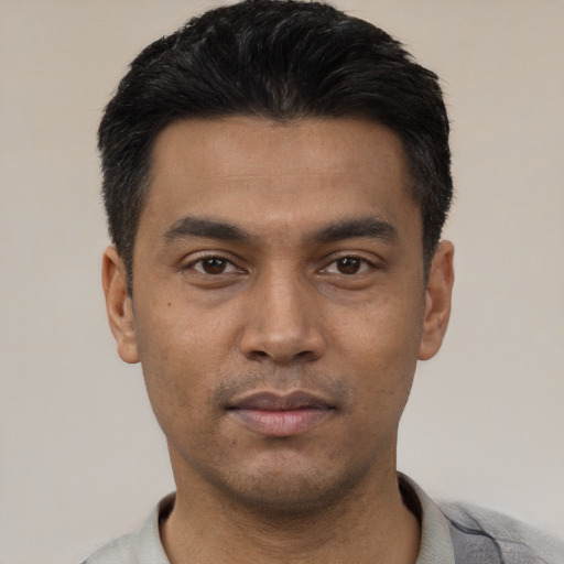 Neutral latino young-adult male with short  black hair and brown eyes