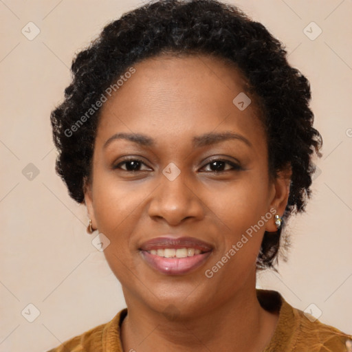 Joyful black adult female with medium  brown hair and brown eyes