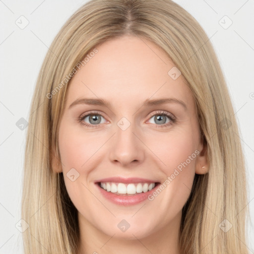 Joyful white young-adult female with long  brown hair and green eyes