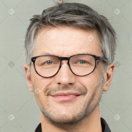 Joyful white adult male with short  brown hair and grey eyes