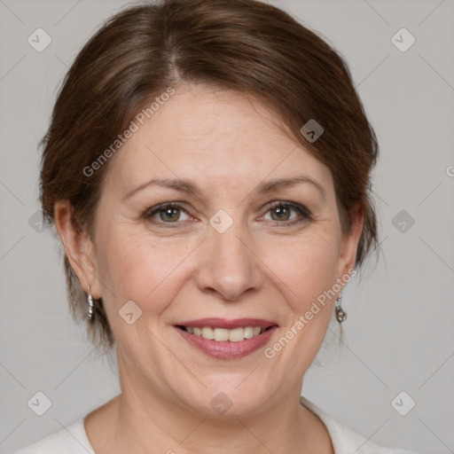 Joyful white adult female with medium  brown hair and grey eyes