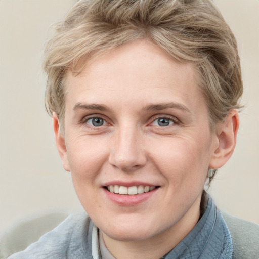 Joyful white adult female with short  brown hair and grey eyes