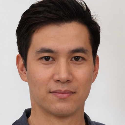 Neutral asian young-adult male with short  brown hair and brown eyes