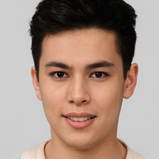 Joyful asian young-adult male with short  brown hair and brown eyes