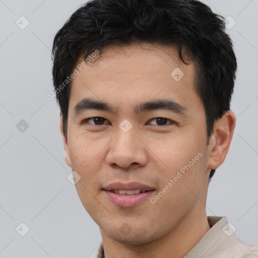 Joyful white young-adult male with short  black hair and brown eyes