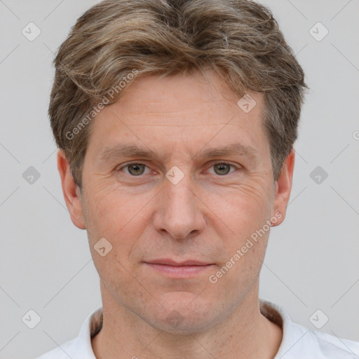 Joyful white adult male with short  brown hair and grey eyes