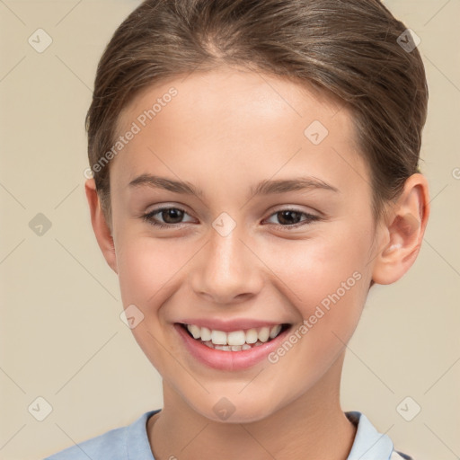 Joyful white child female with short  brown hair and brown eyes