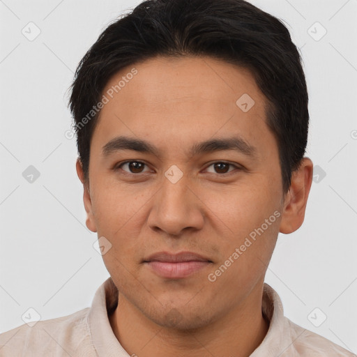 Joyful asian adult male with short  brown hair and brown eyes