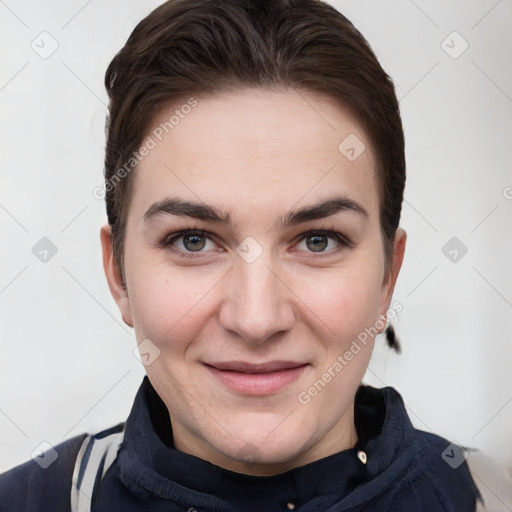 Joyful white young-adult female with short  brown hair and grey eyes