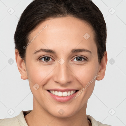 Joyful white young-adult female with short  brown hair and brown eyes