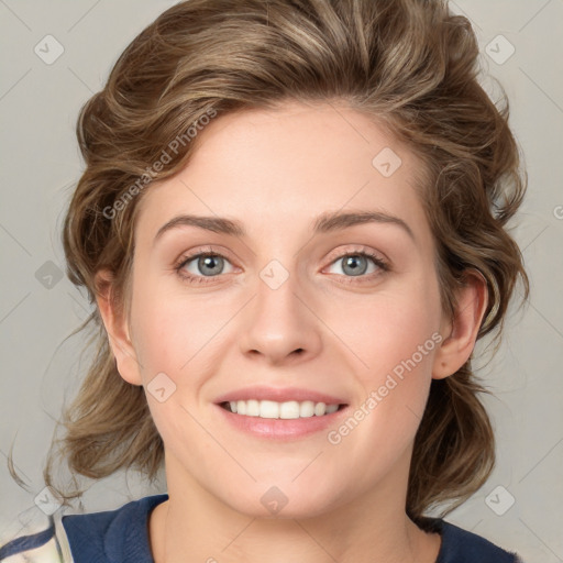 Joyful white young-adult female with medium  brown hair and green eyes