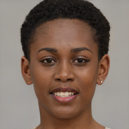 Joyful black young-adult female with short  brown hair and brown eyes