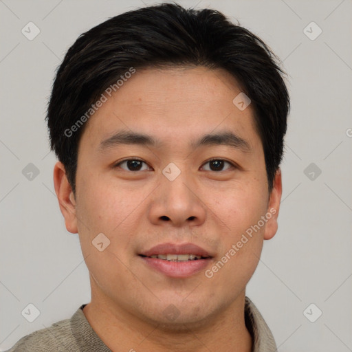 Joyful asian young-adult male with short  brown hair and brown eyes