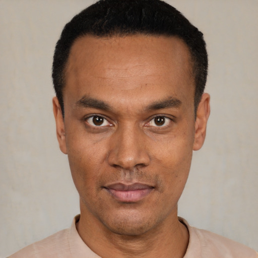 Neutral black young-adult male with short  black hair and brown eyes