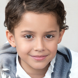 Joyful white child male with short  brown hair and brown eyes