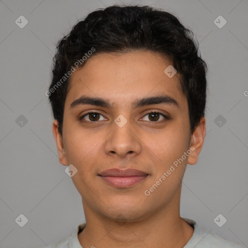 Joyful latino young-adult male with short  brown hair and brown eyes