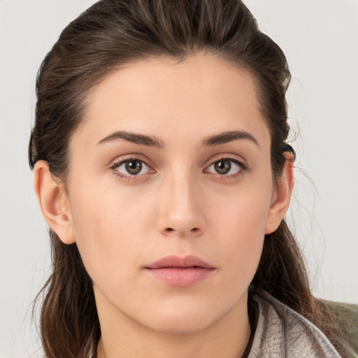 Neutral white young-adult female with long  brown hair and brown eyes