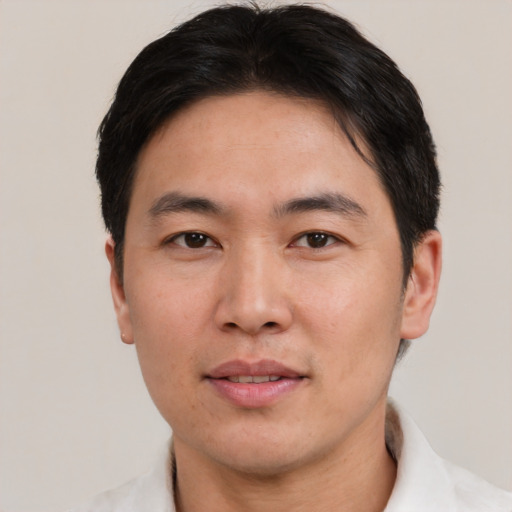 Neutral asian adult male with short  brown hair and brown eyes