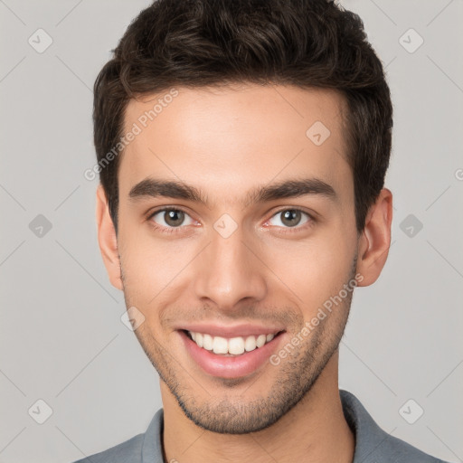 Joyful white young-adult male with short  brown hair and brown eyes