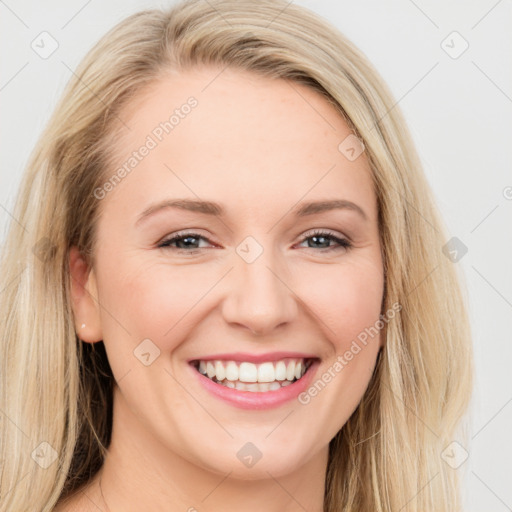 Joyful white young-adult female with long  brown hair and blue eyes