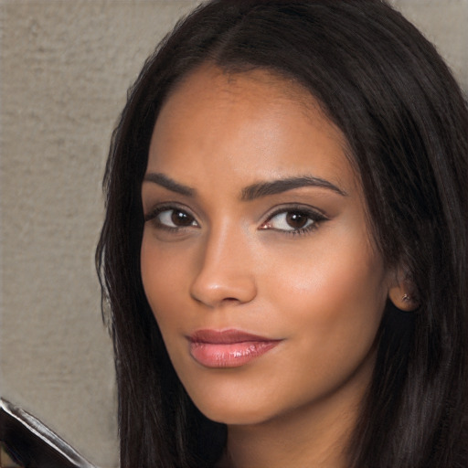 Joyful latino young-adult female with long  black hair and brown eyes