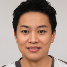 Joyful asian young-adult female with short  black hair and brown eyes