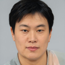 Neutral asian young-adult male with short  brown hair and brown eyes