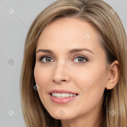 Joyful white young-adult female with long  brown hair and brown eyes