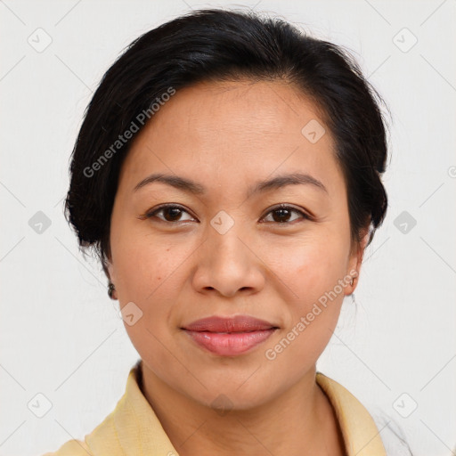 Joyful latino young-adult female with medium  brown hair and brown eyes