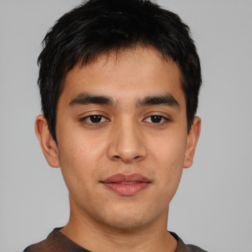 Joyful asian young-adult male with short  black hair and brown eyes