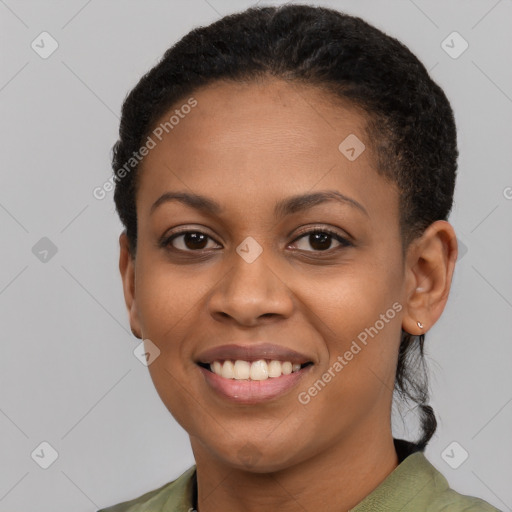 Joyful black young-adult female with short  brown hair and brown eyes