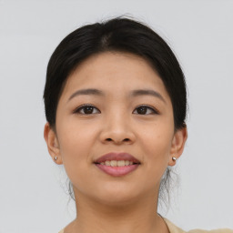 Joyful asian young-adult female with short  brown hair and brown eyes