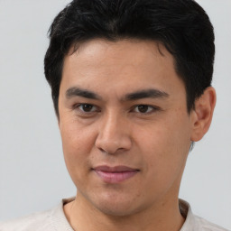 Joyful asian young-adult male with short  brown hair and brown eyes