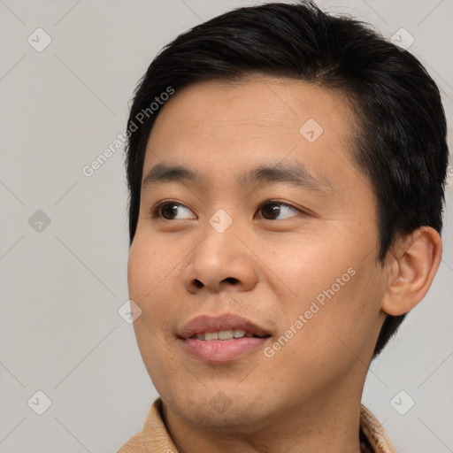 Joyful asian young-adult male with short  brown hair and brown eyes