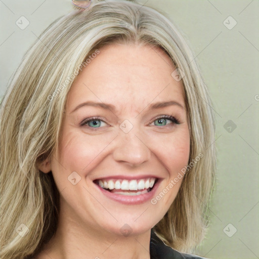 Joyful white young-adult female with long  blond hair and blue eyes