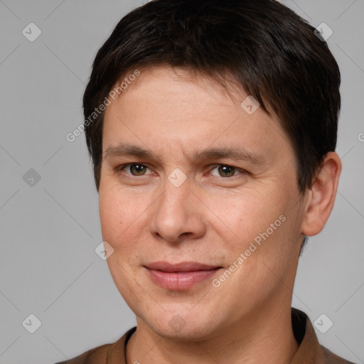 Joyful white adult male with short  brown hair and brown eyes