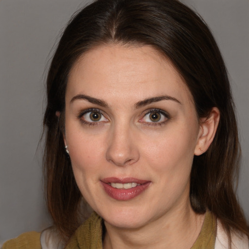 Joyful white young-adult female with medium  brown hair and brown eyes