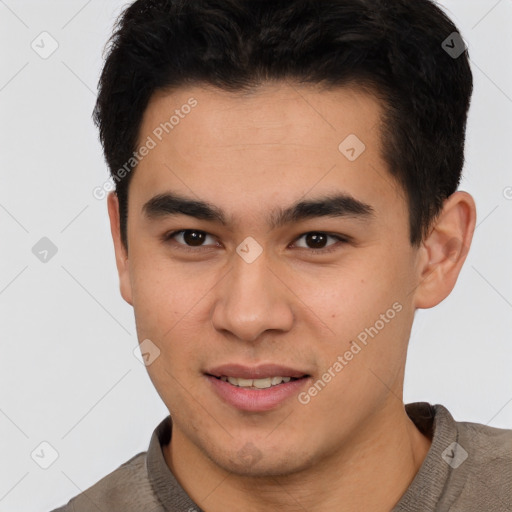 Joyful latino young-adult male with short  brown hair and brown eyes