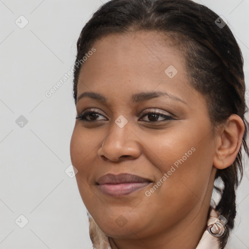 Joyful black young-adult female with short  brown hair and brown eyes