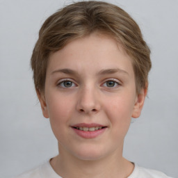 Joyful white child female with short  brown hair and grey eyes