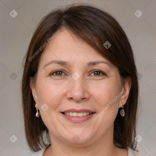 Joyful white adult female with medium  brown hair and grey eyes