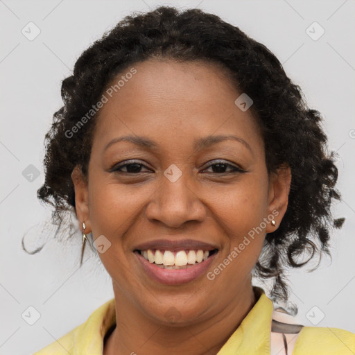 Joyful latino adult female with medium  brown hair and brown eyes