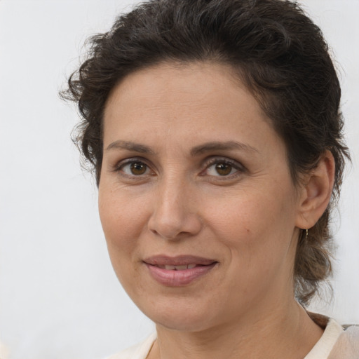 Joyful white adult female with short  brown hair and brown eyes