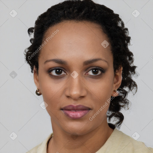 Joyful black young-adult female with long  black hair and brown eyes