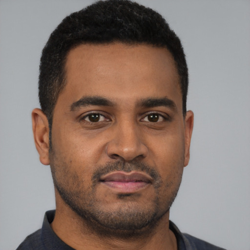 Neutral black young-adult male with short  black hair and brown eyes