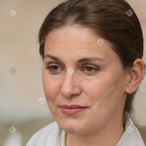 Joyful white adult female with medium  brown hair and brown eyes