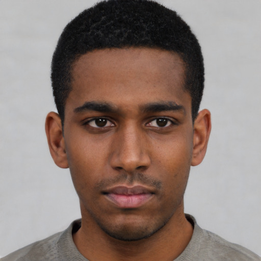 Neutral black young-adult male with short  black hair and brown eyes
