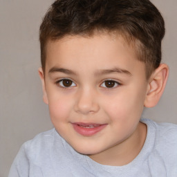 Joyful white child male with short  brown hair and brown eyes